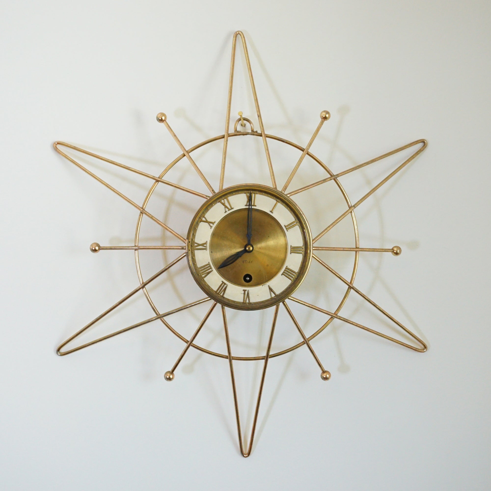Mid-Century WELBY Starburst Wire Brass 8-Day Windup Wall Clock with Key. Made in Germany.