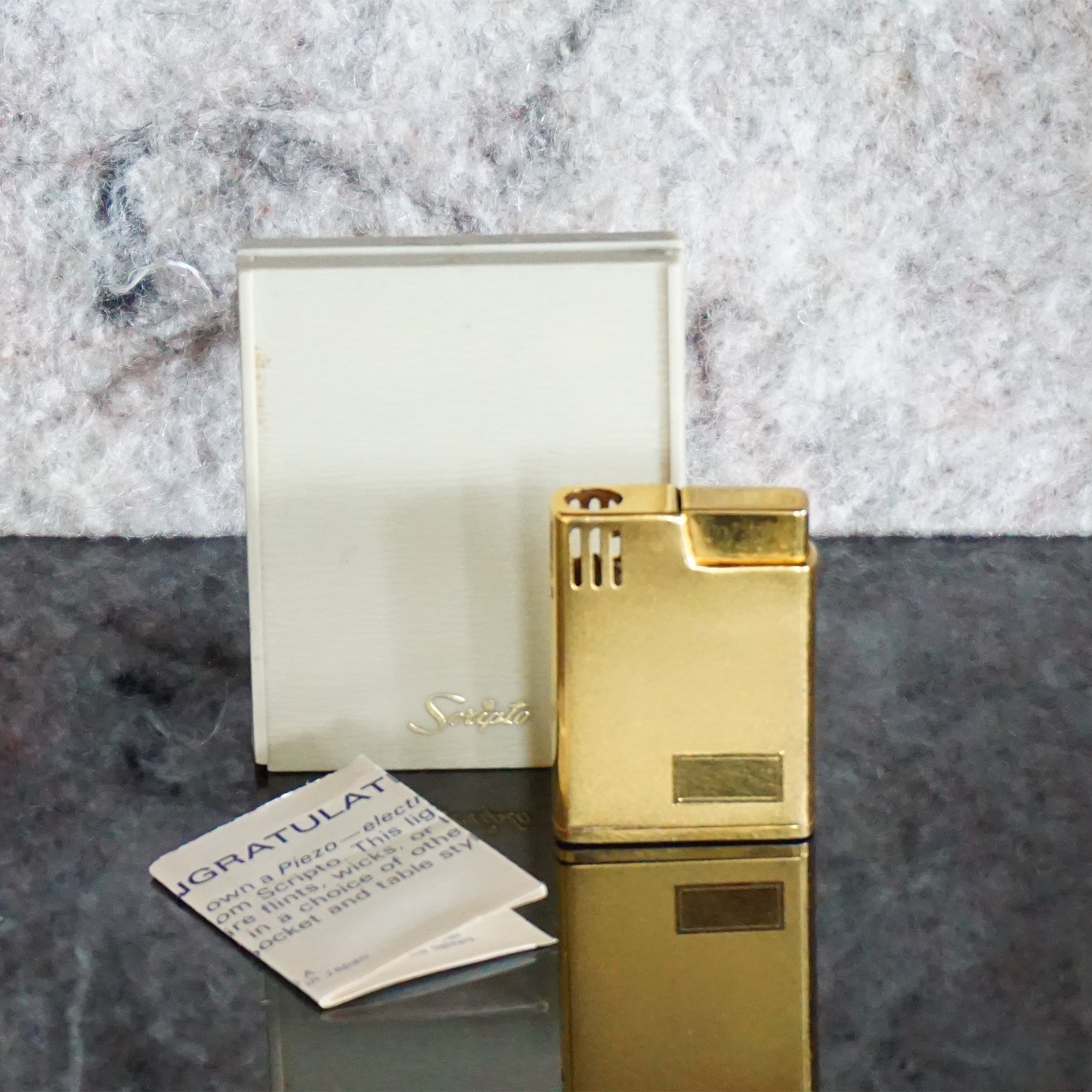 Collectible Vintage Gold Toned Piezoelectric Butane Lighter from SCRIPTO. Made in Japan.
