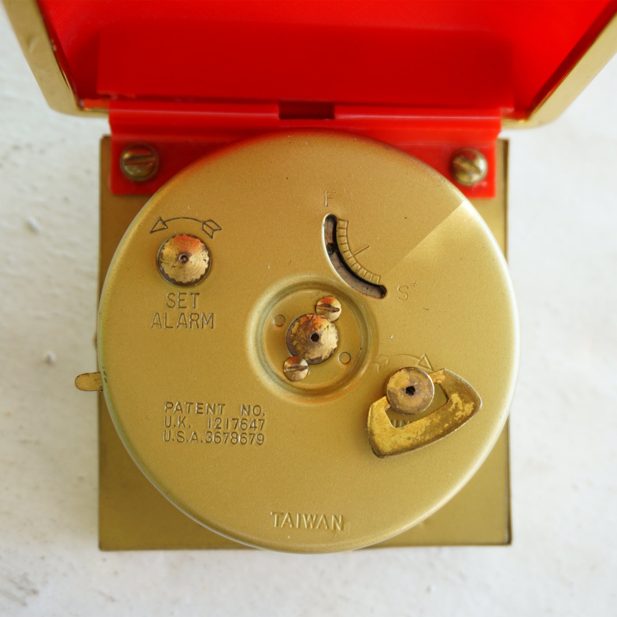 Vintage WESTCLOX Gold Tone Mechanical Travel Alarm Clock in Red Case. Made by General Time in Taiwan.