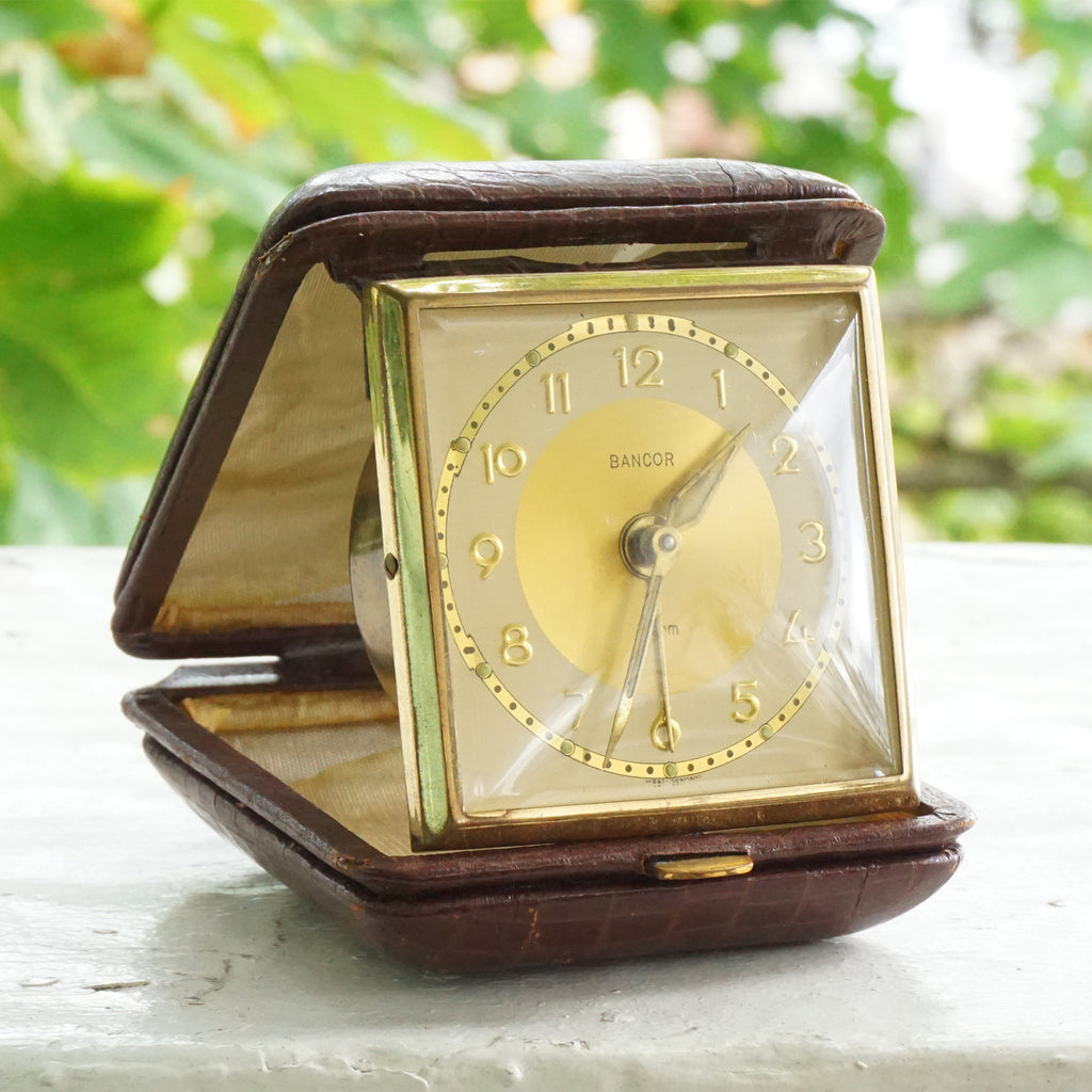 Vintage BANCOR Gold Tone Windup Travel Alarm Clock in Brown Leather Textured Case. Made in West Germany.