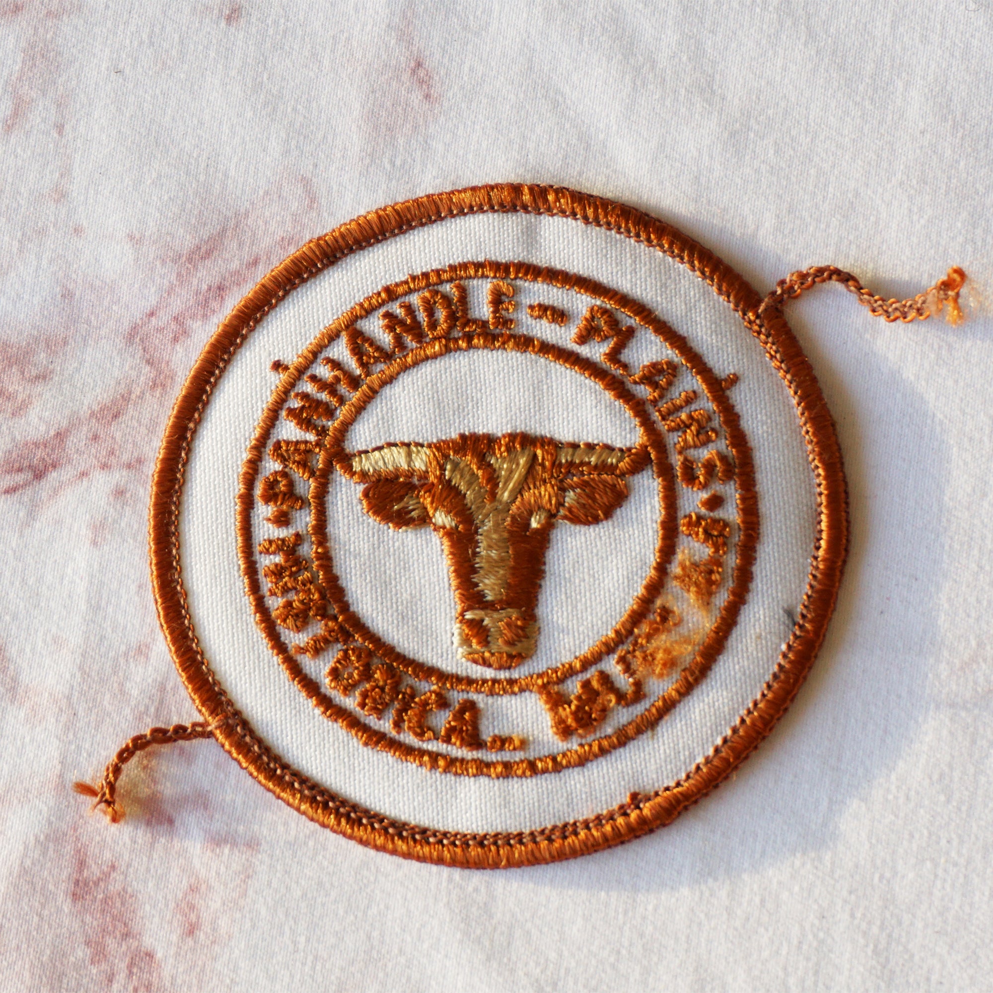 1980s Vintage 4" Panhandle-Plains HIstorical Museum Clothing Patch with Cow. Brown and White Colors.