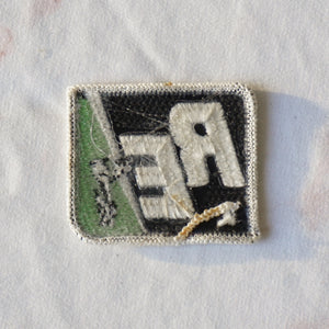 1980s Vintage 2.25" RE Rural Electric Clothing Patch with Lightning and Person. Black, White and Green Colors.