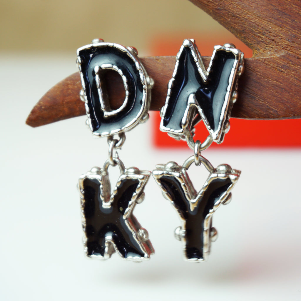 Vintage DKNY Clip-on Earrings with Black Enamel and Silver-toned "DK" and "NY"