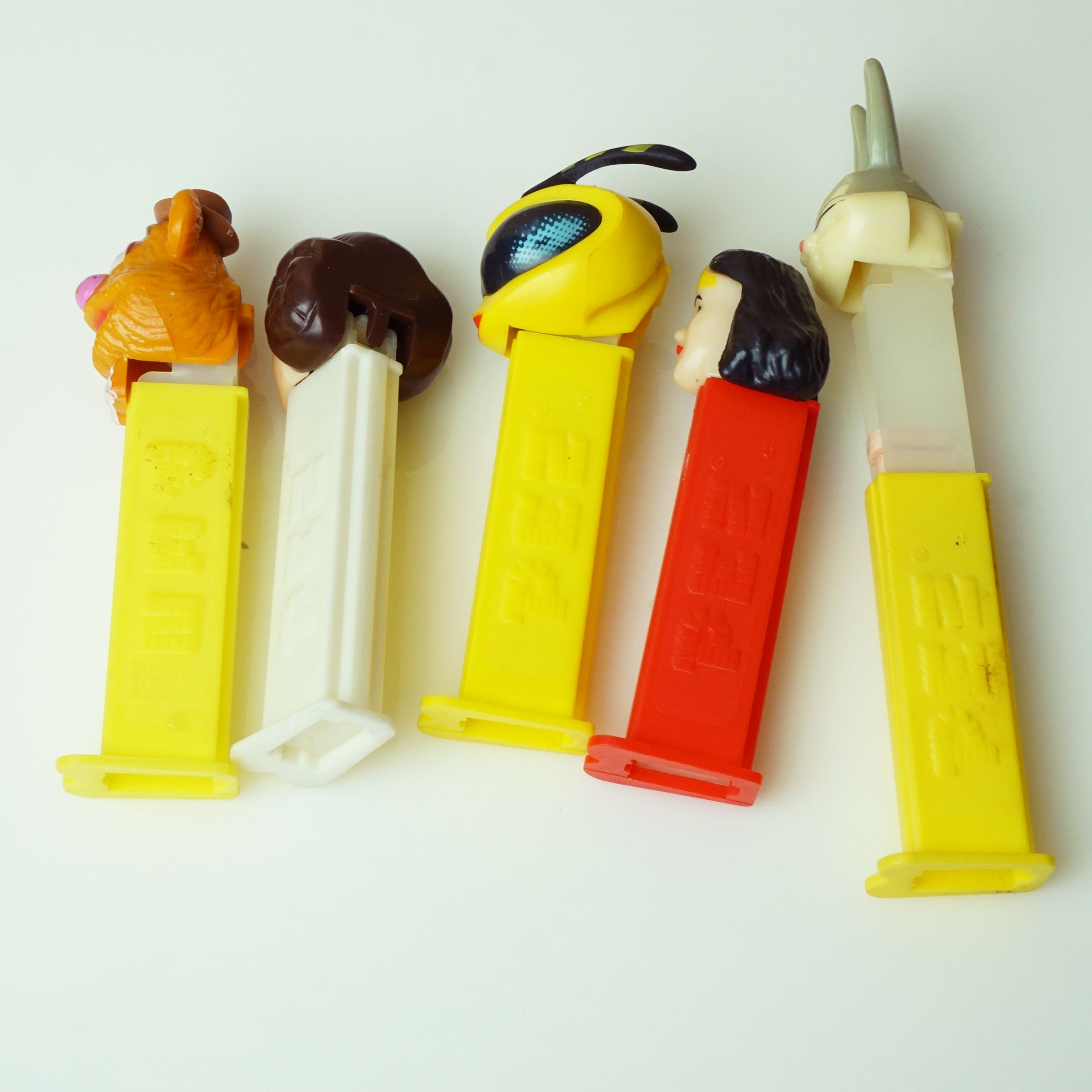 Set of (5) Vintage PEZ Dispensers: Fozzie, Leia, Bee, Wonder Woman, Bugs Bunny