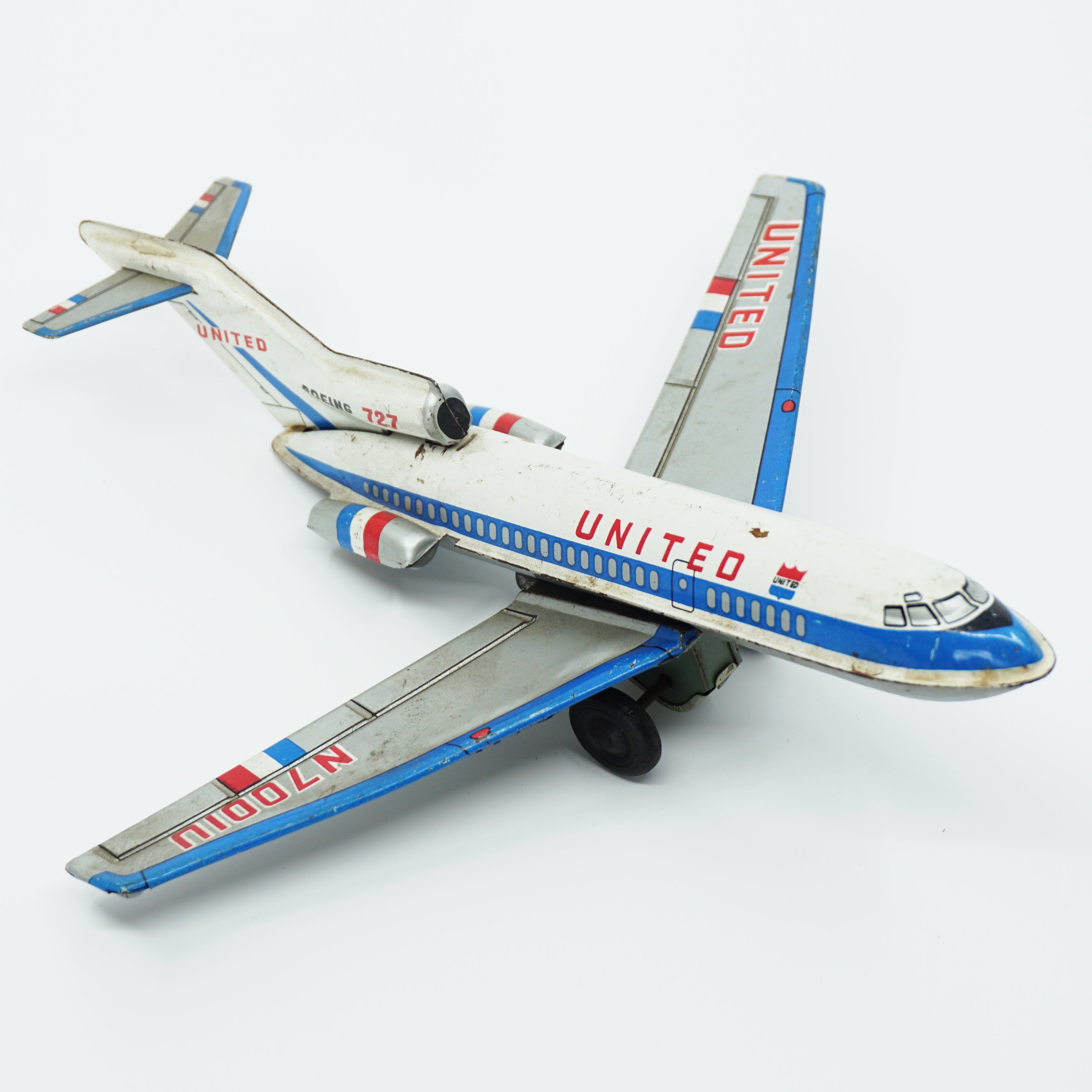 Mid-Century Vintage United Boeing 727 Toy Jet Airplane with Friction Motor. Made in Japan.