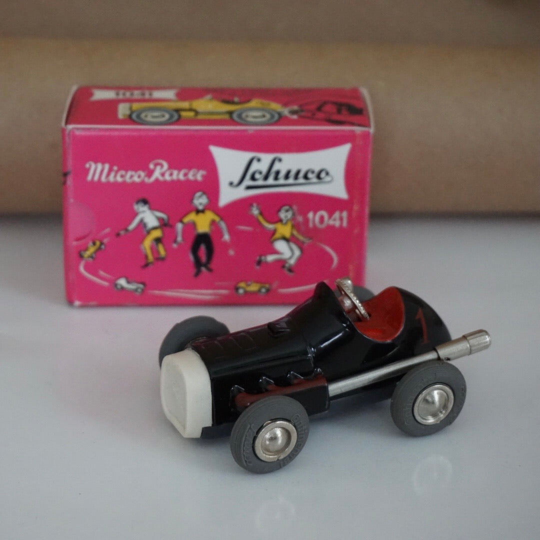 1990s Schuco Midget Micro Black Racer Car #1041. Red interior.